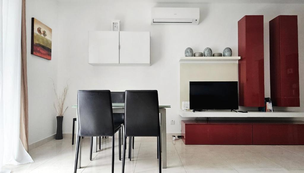 TV a/nebo společenská místnost v ubytování Calypso Apartment