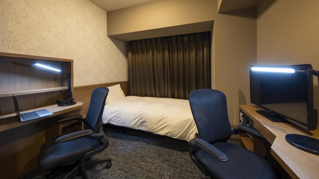 TV a/nebo společenská místnost v ubytování Dormy Inn Kobe Motomachi Natural Hot Springs