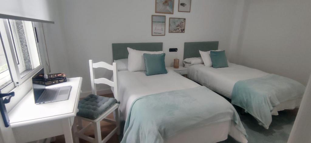 Кровать или кровати в номере Apartamento Illa Salvora, Portonovo