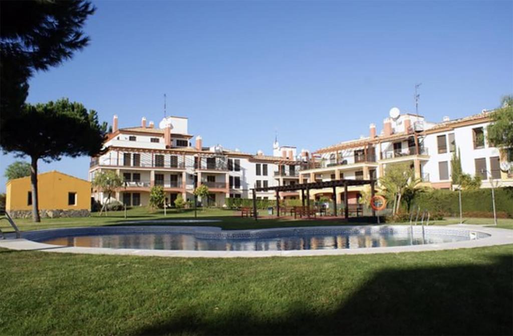 a park with a fountain in front of a building at Vistas al Guadiana in Ayamonte
