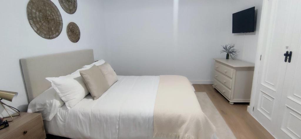 Кровать или кровати в номере Apartamento Illa Salvora, Portonovo