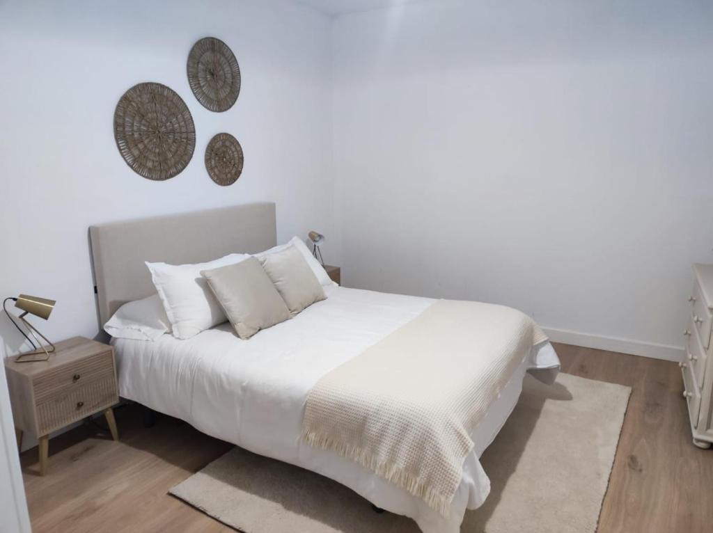Кровать или кровати в номере Apartamento Illa Salvora, Portonovo