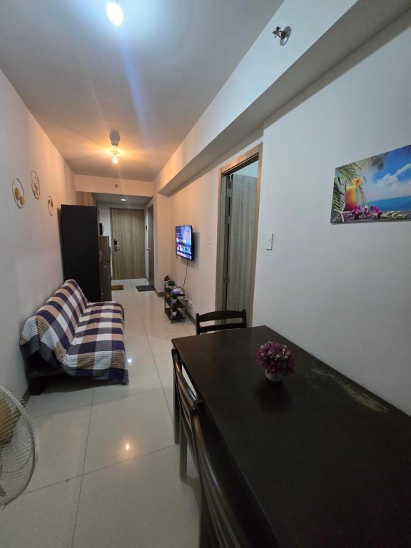TV a/nebo společenská místnost v ubytování Sojourn in S Residences