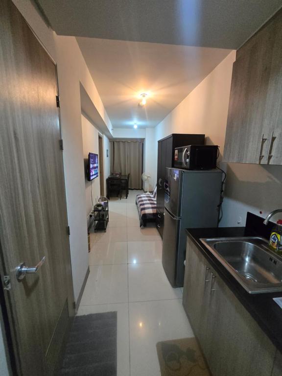 Kuchyň nebo kuchyňský kout v ubytování Sojourn in S Residences
