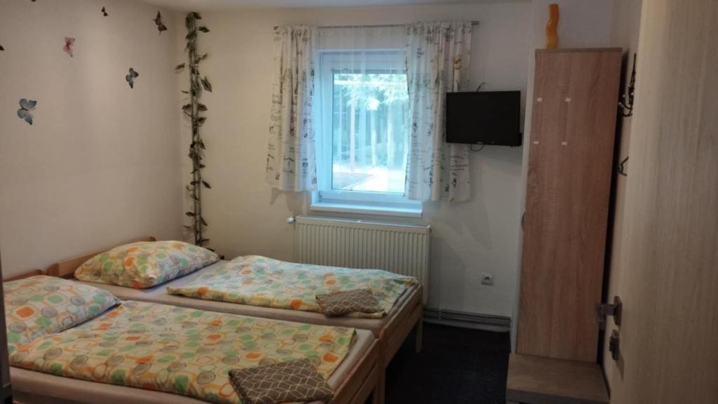 Postel nebo postele na pokoji v ubytování Villa LIKE "garden-grill"
