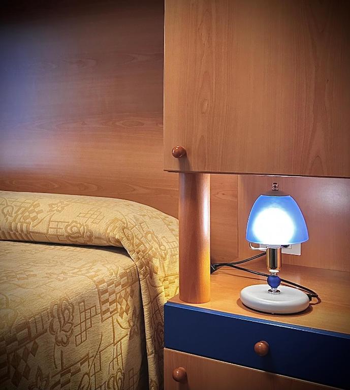 Postel nebo postele na pokoji v ubytování Hotel La Parigina