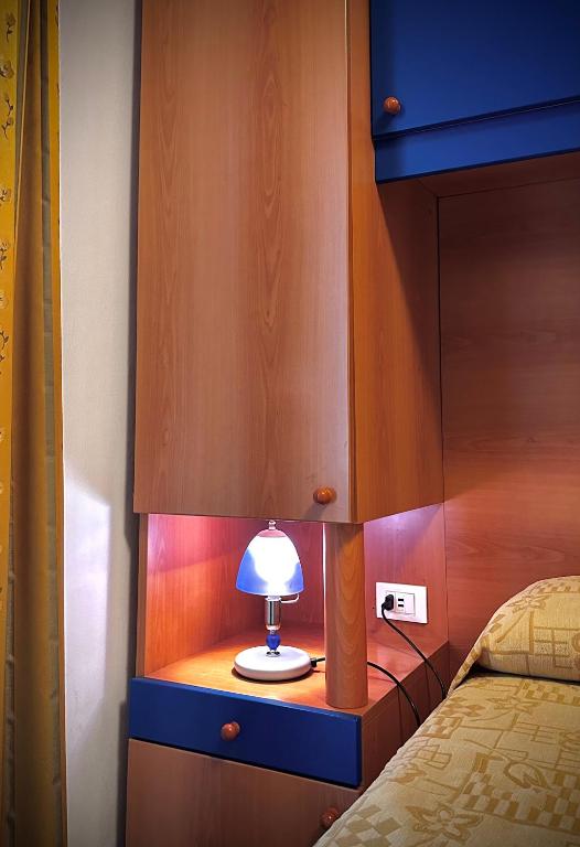 Postel nebo postele na pokoji v ubytování Hotel La Parigina