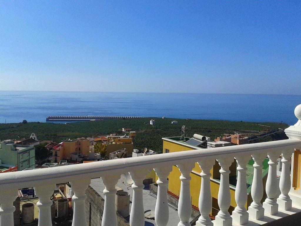 a view of the ocean from a balcony at Apartamentos Ana in Tazacorte