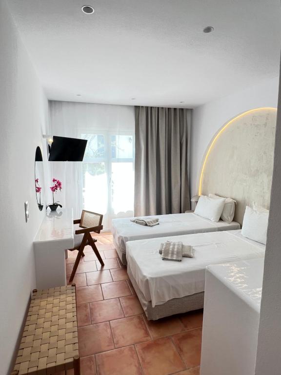 Letto o letti in una camera di Hotel Galini