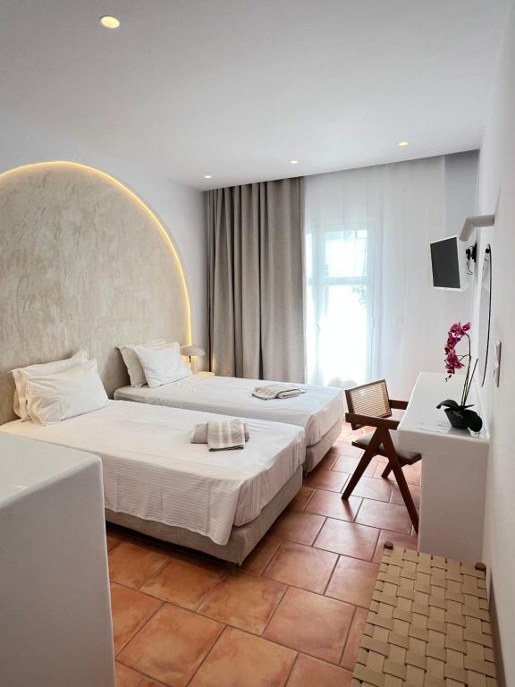 Letto o letti in una camera di Hotel Galini
