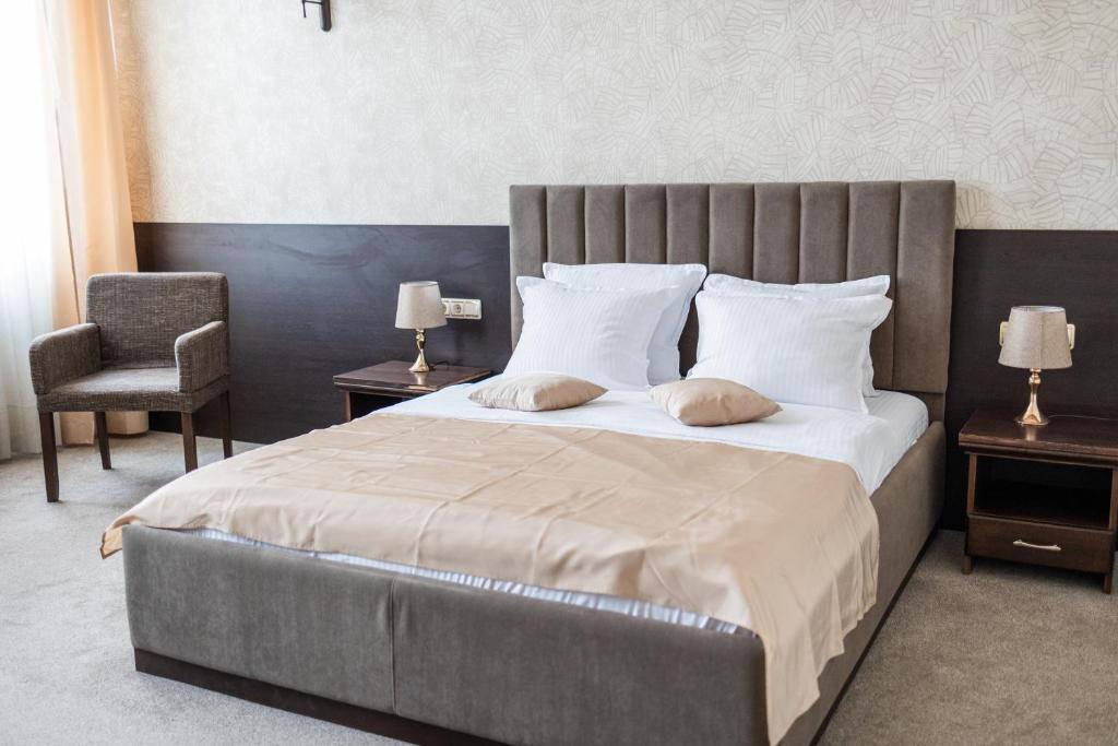 Postel nebo postele na pokoji v ubytování Hotel Neptun