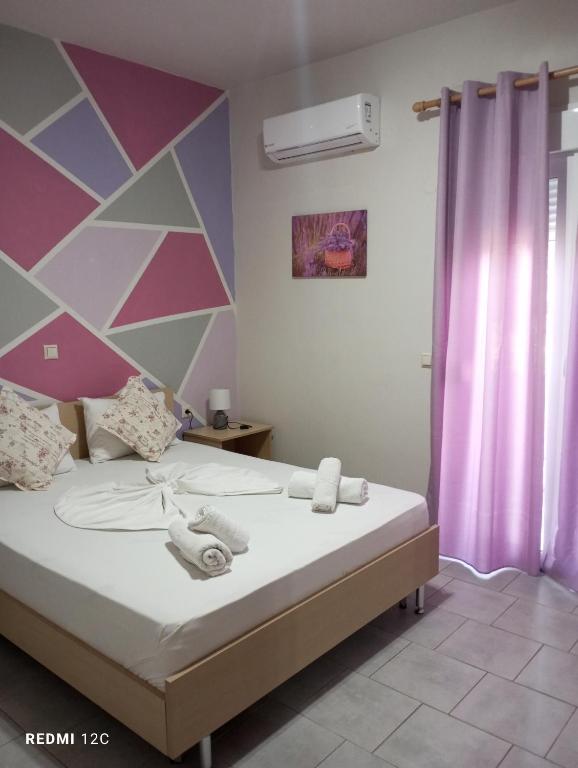 Postel nebo postele na pokoji v ubytování Sunray Apartments