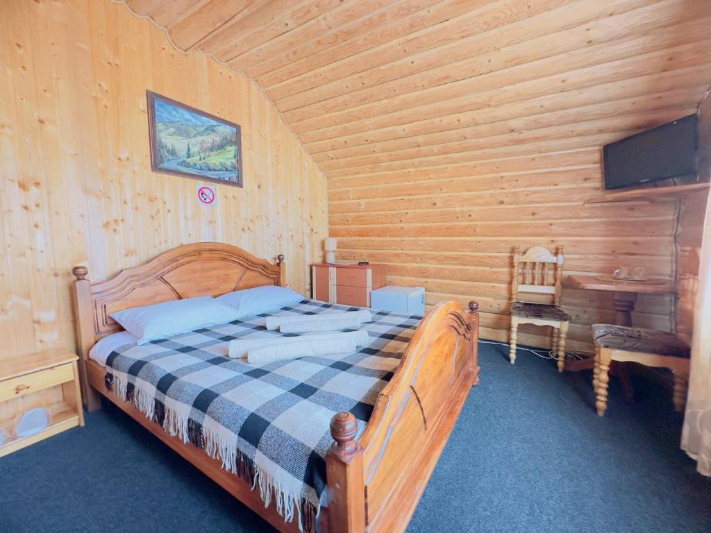 Postel nebo postele na pokoji v ubytování Trembita