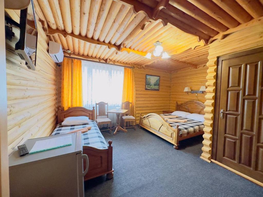 Postel nebo postele na pokoji v ubytování Trembita