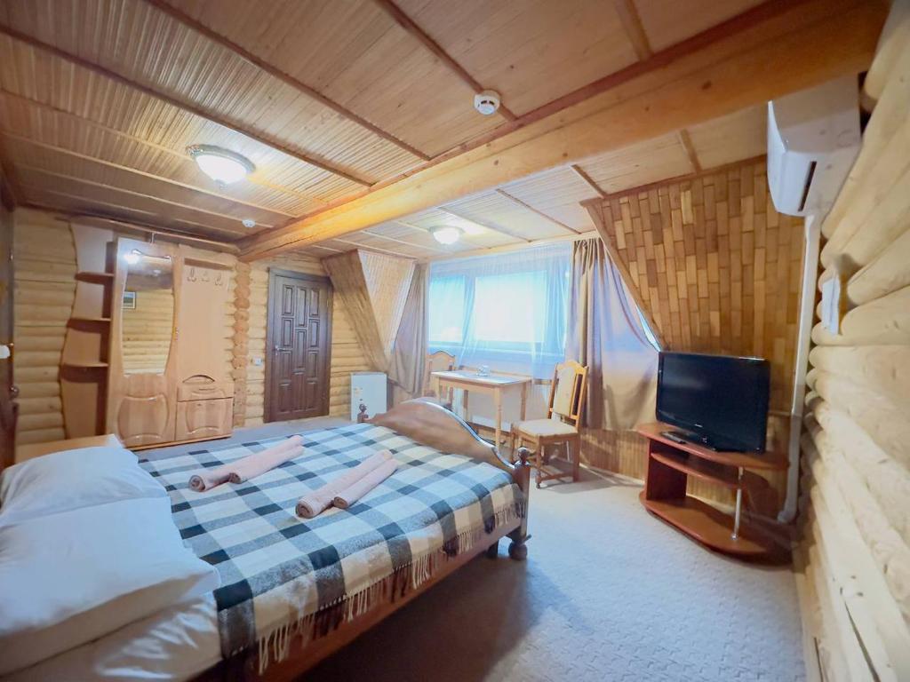 Postel nebo postele na pokoji v ubytování Trembita