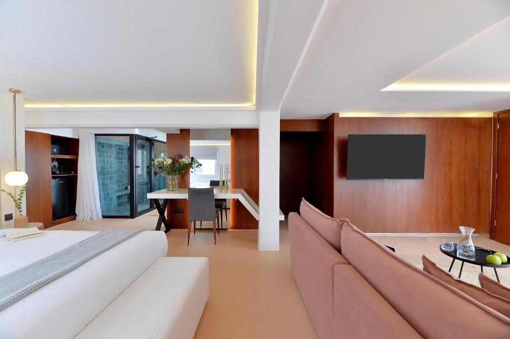 TV a/nebo společenská místnost v ubytování Alva Athens Hotel