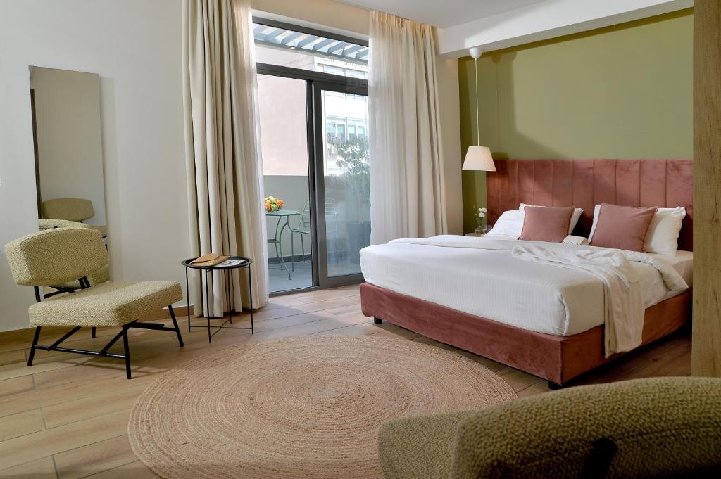 Postel nebo postele na pokoji v ubytování Alva Athens Hotel