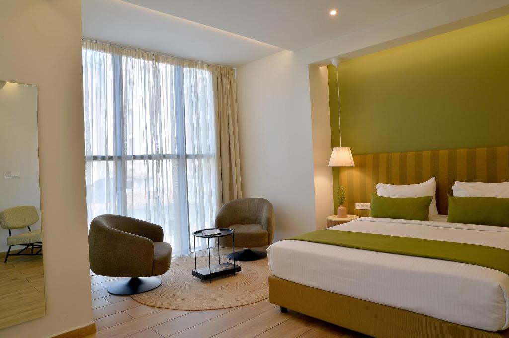 Postel nebo postele na pokoji v ubytování Alva Athens Hotel