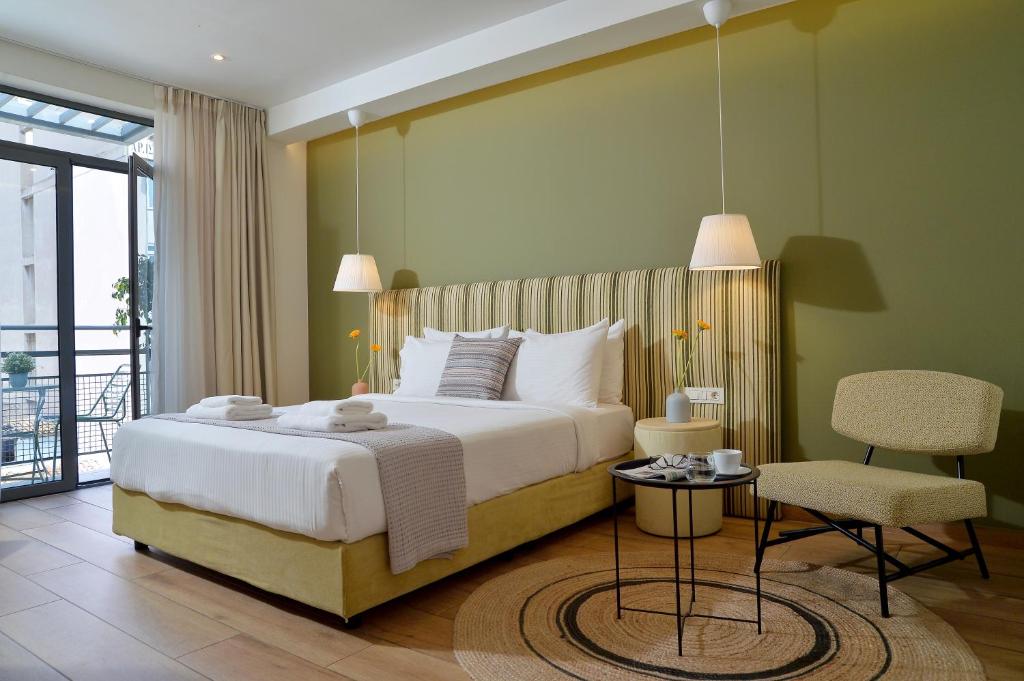 Postel nebo postele na pokoji v ubytování Alva Athens Hotel