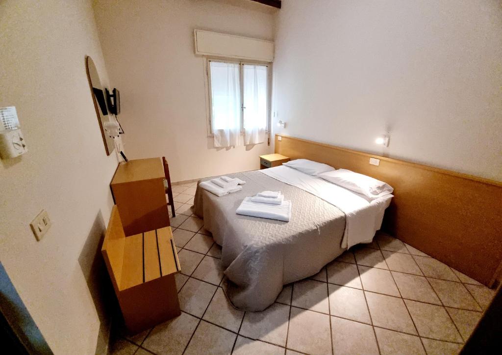 Postel nebo postele na pokoji v ubytování Hotel Anny