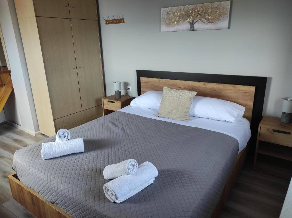 A bed or beds in a room at Marilena's house