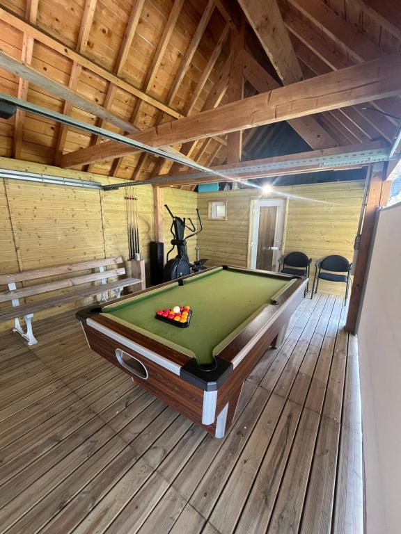 a room with a pool table in a house at La datcha in Drouvin-les-Marais