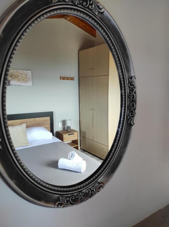 A bed or beds in a room at Marilena's house