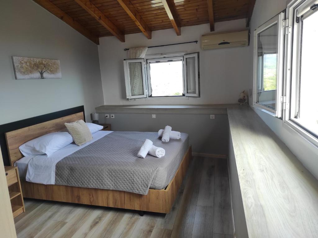 A bed or beds in a room at Marilena's house