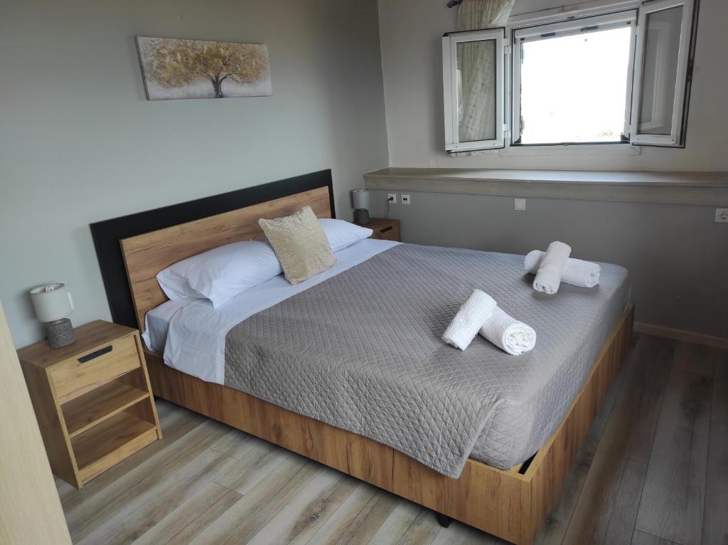 A bed or beds in a room at Marilena's house
