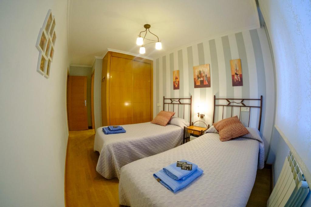 A bed or beds in a room at Apartamento Sella y Mar - VUT12AS
