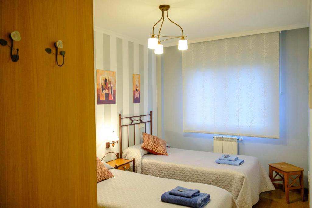 A bed or beds in a room at Apartamento Sella y Mar - VUT12AS