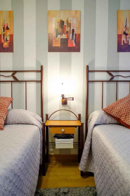 A bed or beds in a room at Apartamento Sella y Mar - VUT12AS