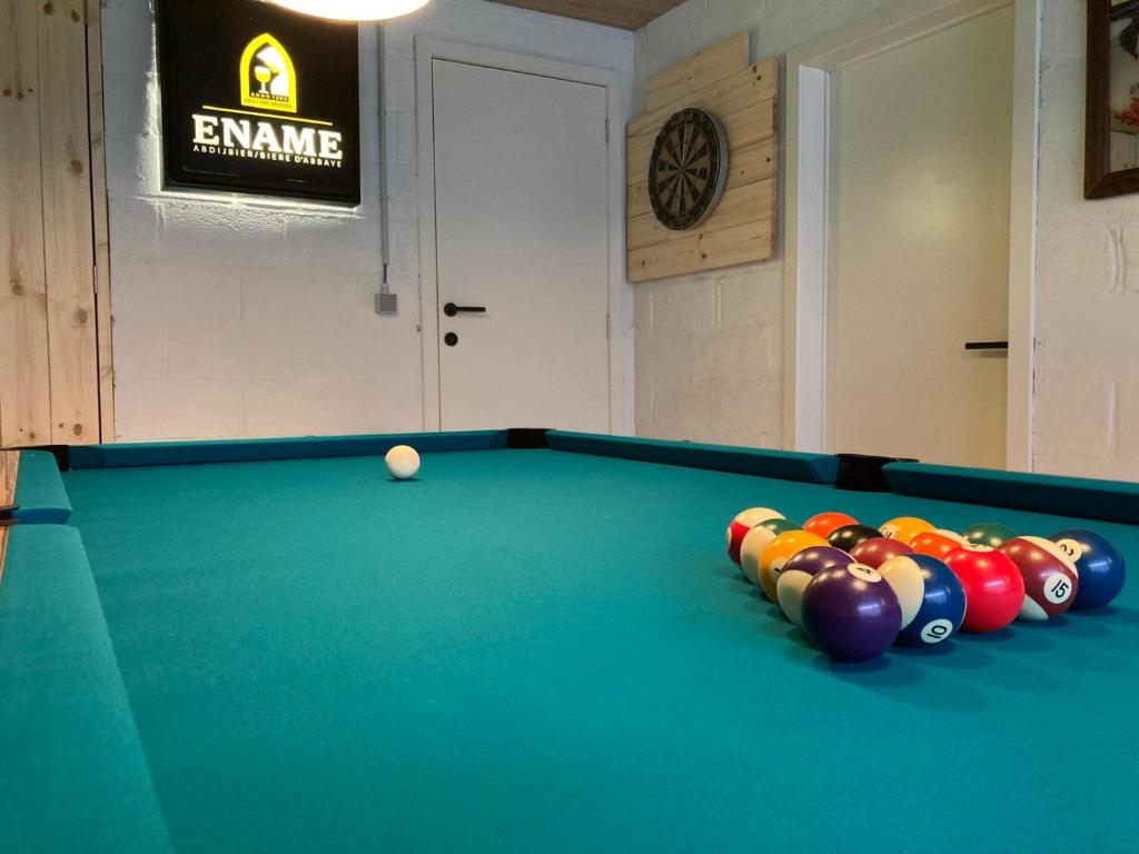 a room with a pool table and a ball at Balcons de la semois in Vresse-sur-Semois
