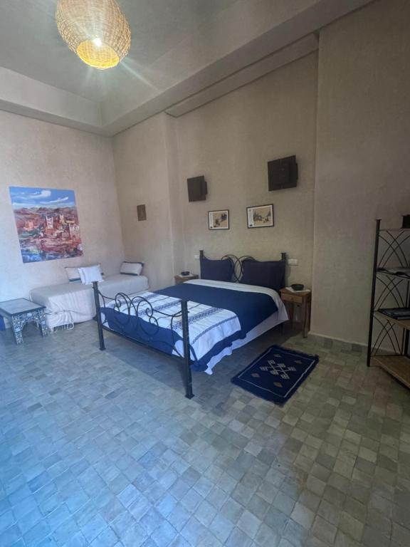 Postel nebo postele na pokoji v ubytování Dar Kamango