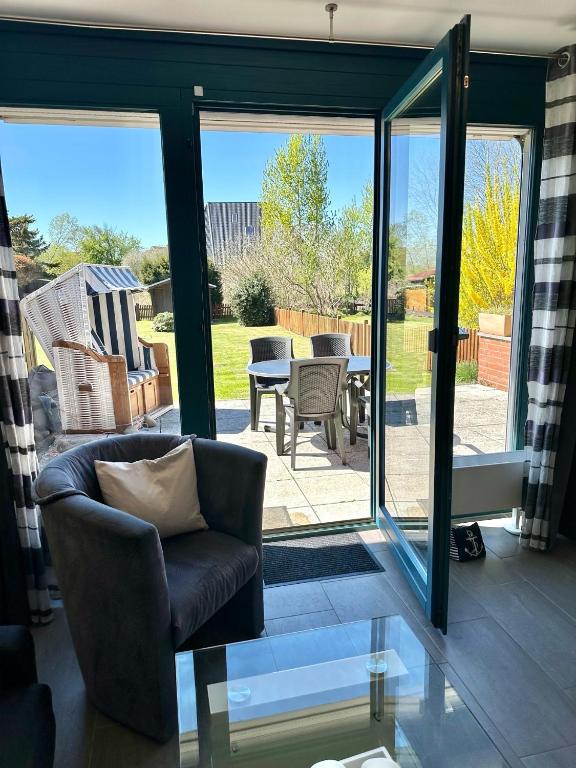 a living room with sliding glass doors leading to a patio at 7034 Enseling in Dahme