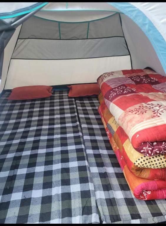 Postel nebo postele na pokoji v ubytování Balaji camping kedarnath