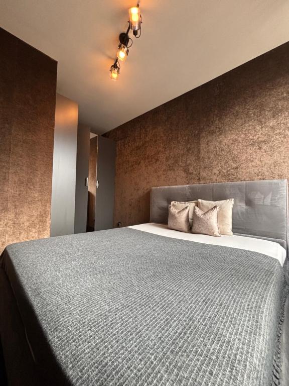 a bedroom with a large bed in a room at Business Park Sofia Cozy Lux & Private Garage Option in Sofia