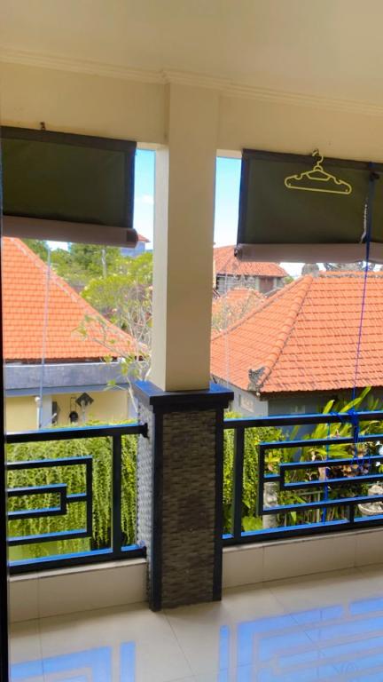 Balkón nebo terasa v ubytování Ariartha homestay