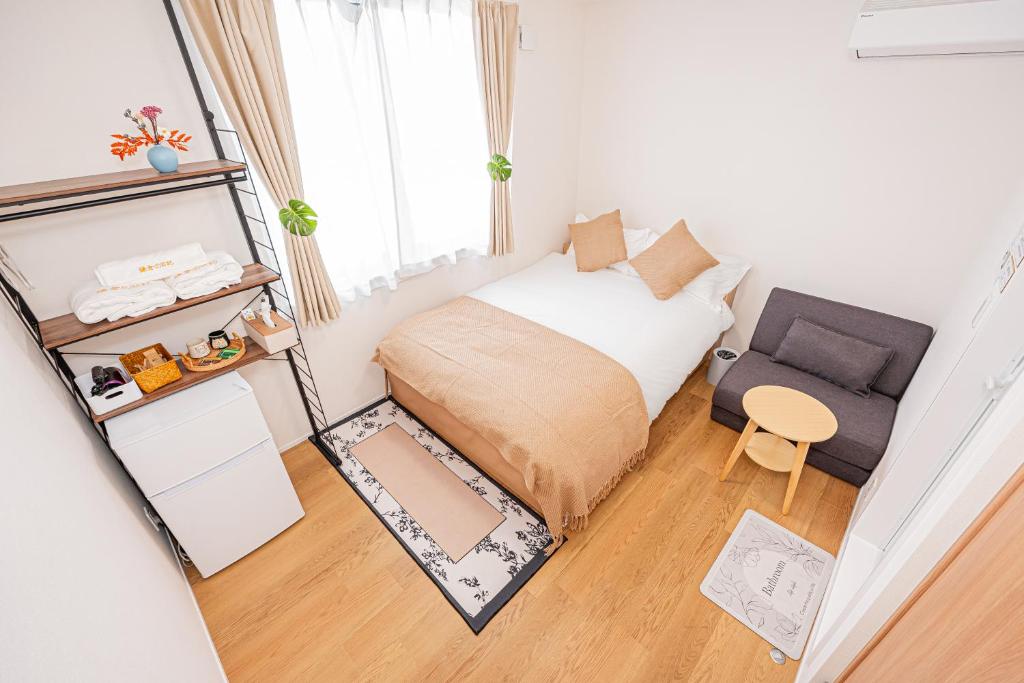 Postel nebo postele na pokoji v ubytování Kamakura no Nikki