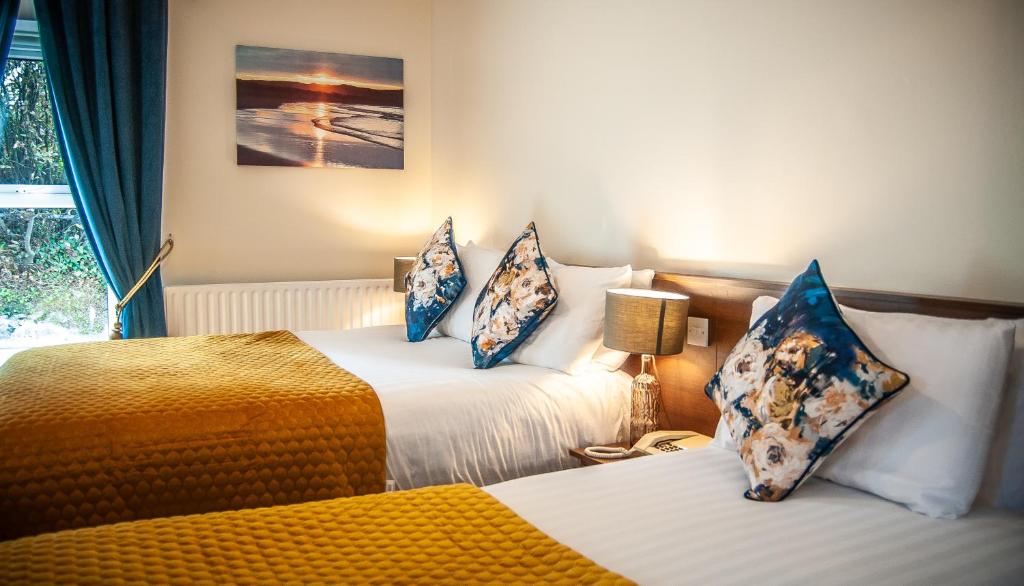 Postel nebo postele na pokoji v ubytování Arnolds Hotel