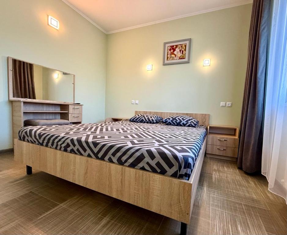 Postel nebo postele na pokoji v ubytování Ассоль