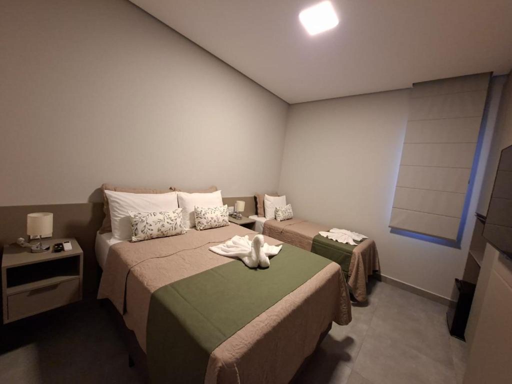 Postel nebo postele na pokoji v ubytování HOTEL JD cravinhos