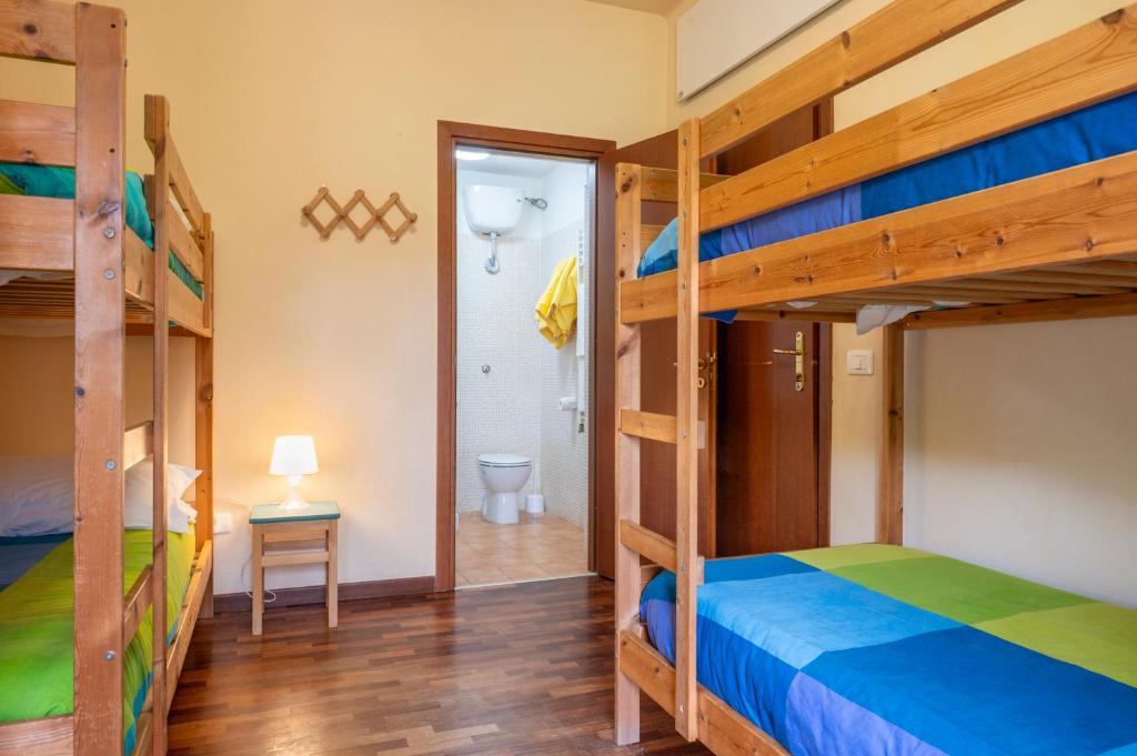 Postel nebo postele na pokoji v ubytování Rifugio Giuliano Marini