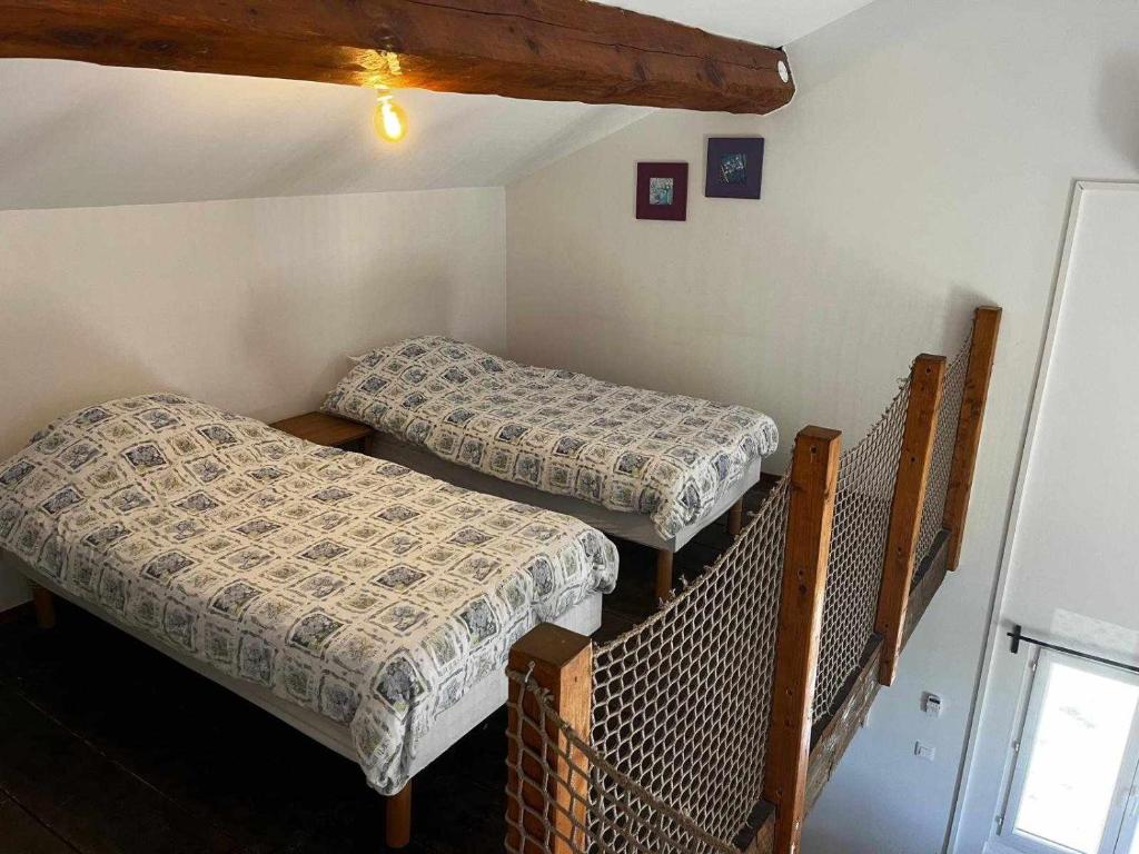 Postel nebo postele na pokoji v ubytování Gîte The Butterfly - 1 bedroom and mezzanine