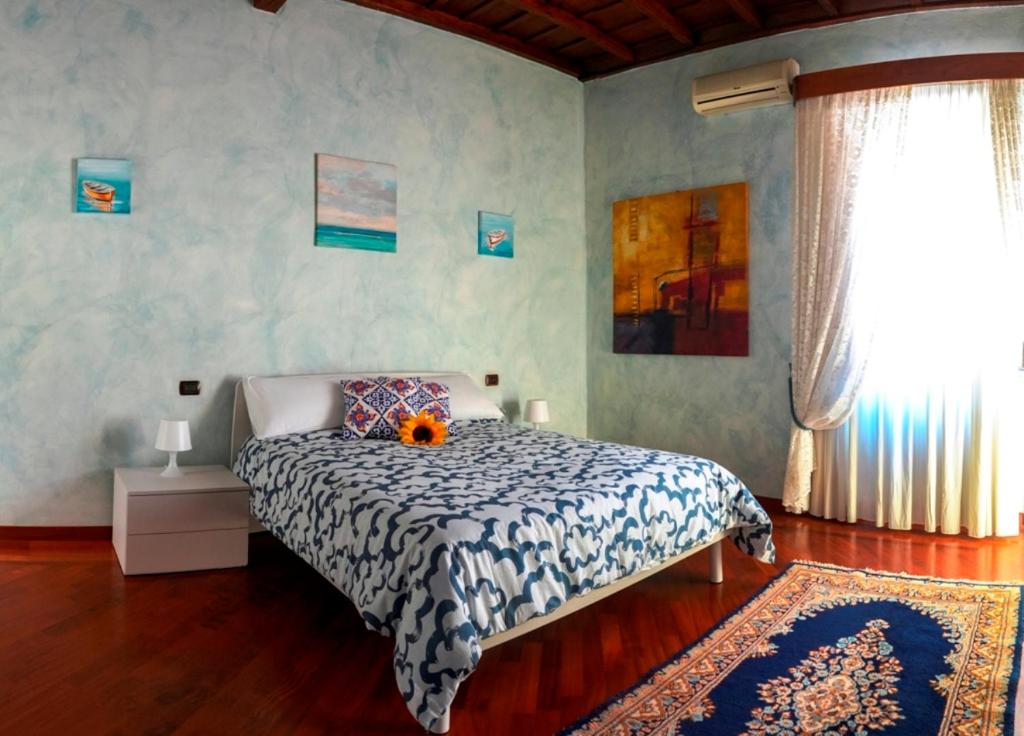 Postel nebo postele na pokoji v ubytování Un Posto al Centro