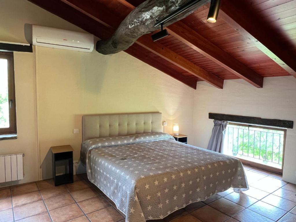 Postel nebo postele na pokoji v ubytování Casa Vella del Cuní