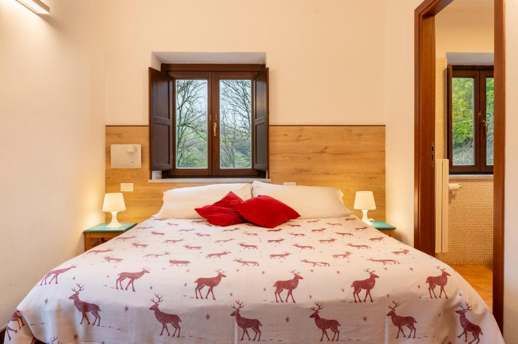Postel nebo postele na pokoji v ubytování Rifugio Giuliano Marini
