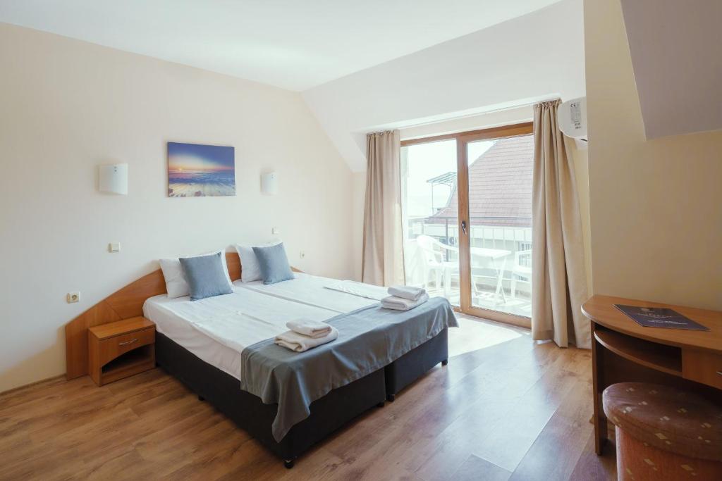 Postel nebo postele na pokoji v ubytování Hotel Milan