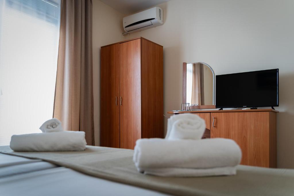 Postel nebo postele na pokoji v ubytování Hotel Milan