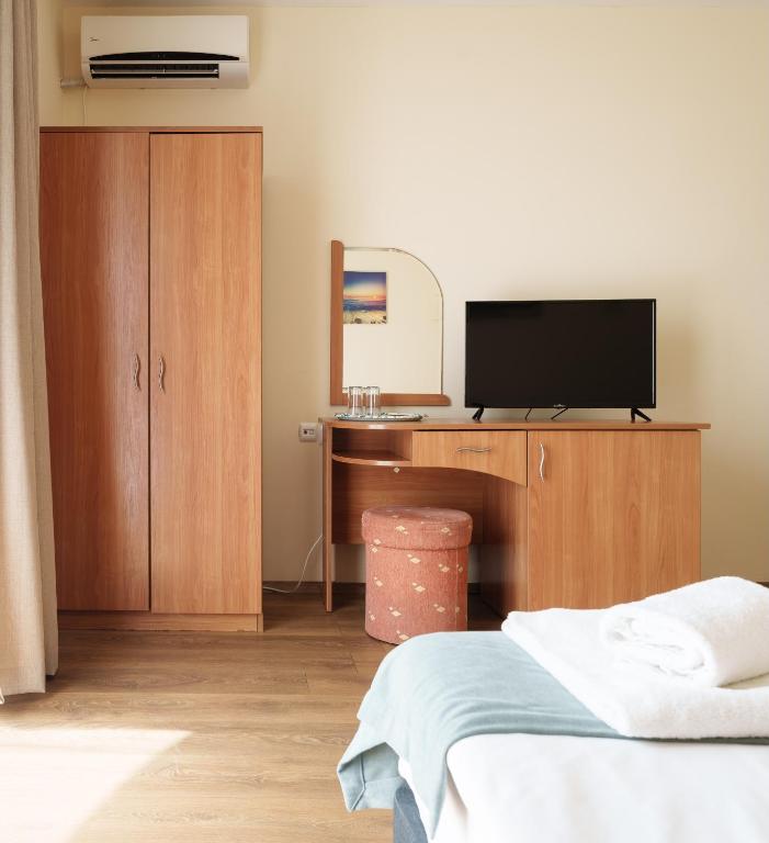 TV a/nebo společenská místnost v ubytování Hotel Milan